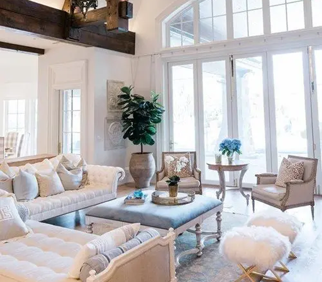 Elegant living room with large windows.