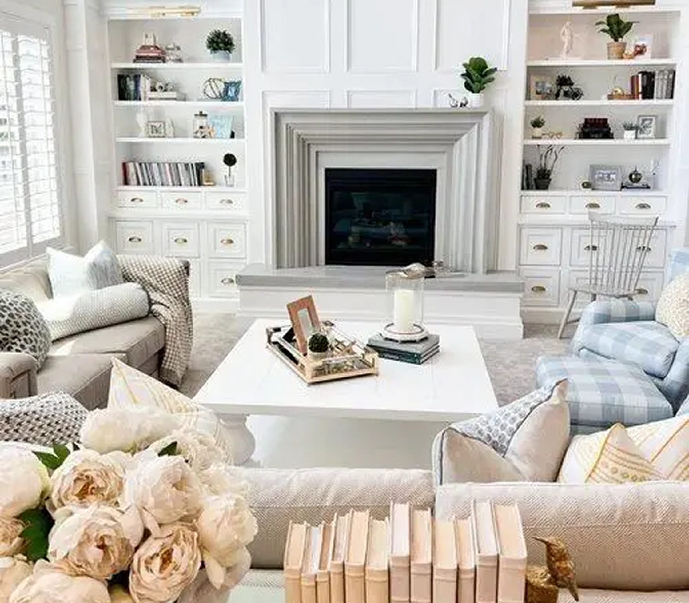 Elegant living room with fireplace and books.