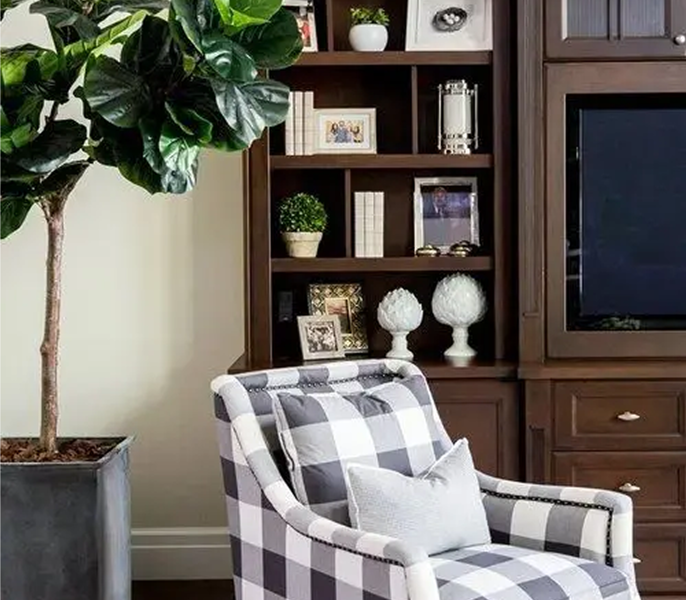 Plaid chair in cozy living room corner.