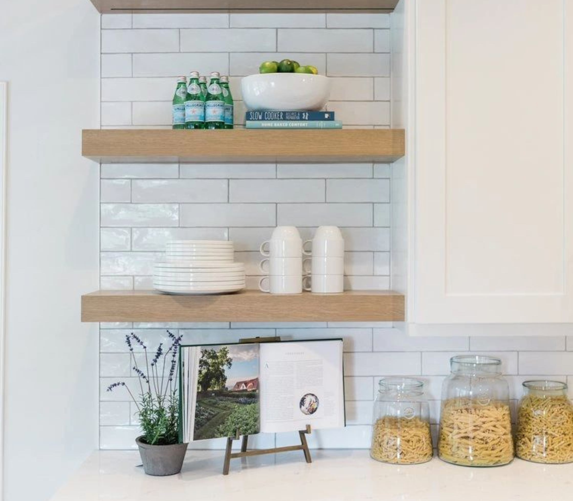 Kitchen shelves with dishes and decor items.