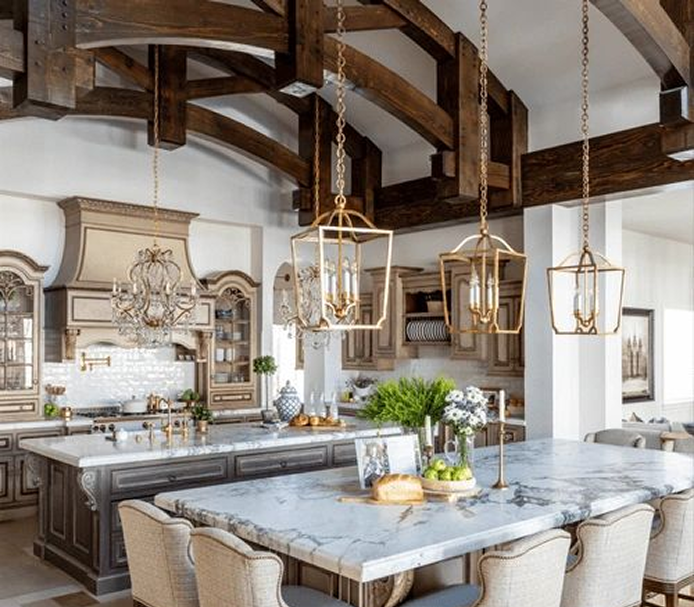 Rustic kitchen with marble island and chandeliers.