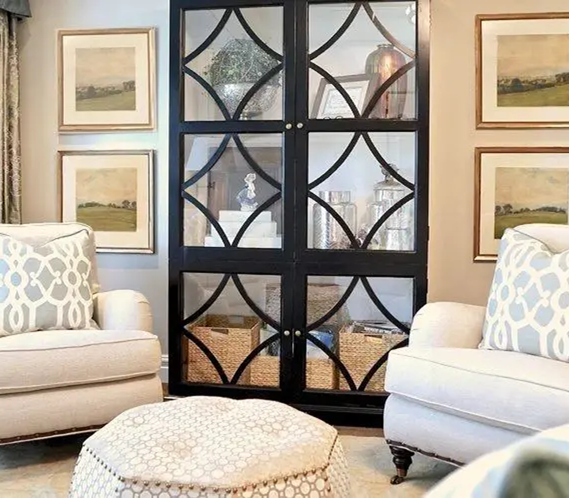Elegant living room with patterned armchairs.